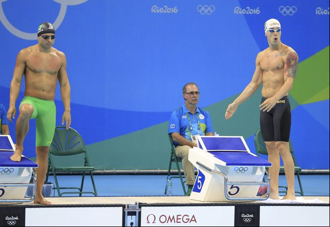 2016 Rio Olympics - Swimming - Preliminary - Men's 50m Freestyle - Heats - Olympic Aquatics Stadium - Rio de Janeiro, Brazil - 11/08/2016. Italo Duarte (BRA) of Brazil and Bruno Fratus (BRA) of Brazil prepare to compete